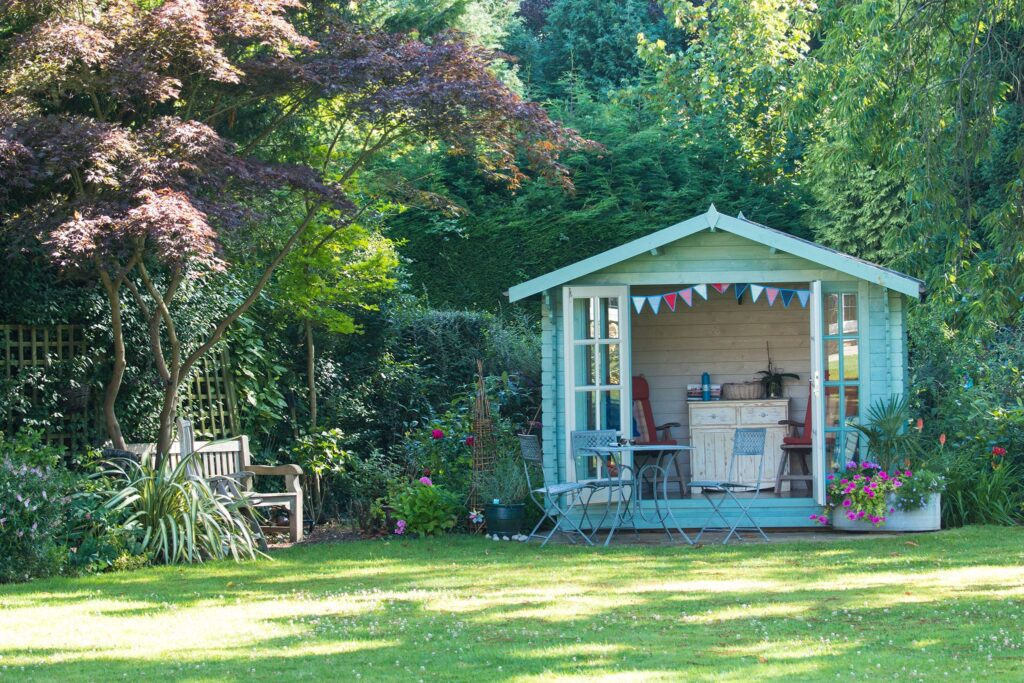 How can I make my shed look more like a natural part of the landscape?